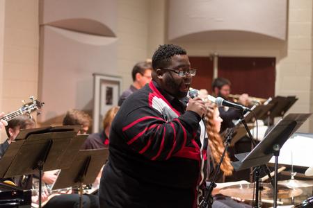 Cameron Smith, music major, sings with the jazz band at their annual fall concert.  - Photo by Nikki Grim