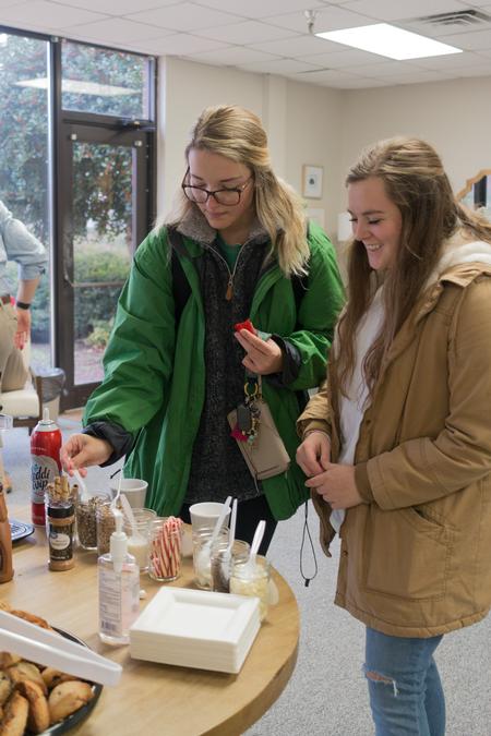 Students enjoy coffee and treats in the Vocatio Center during Stress-Free Friday before finals week. - Photo by Lynn Tucker