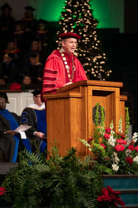 Dub Oliver, president of the university, welcomes guests and graduates to Fall Commencement. - Photo by Kristi McMurry Woody