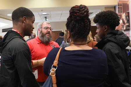Jonathan Allen, clinical coordinator and assistant professor of athletic training, talks to prospective students and families during Day at the U. - Photo by Sarah Palmer Goff