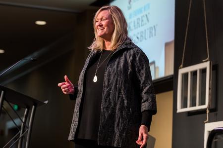 Author Karen Kingsbury speaks during the Auxiliary Banquet in the Grant Center.  - Photo by Kristi McMurry Woody