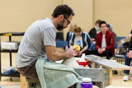 Simon Levin leads a ceramics workshop for the art department. - Photo by Nikki Grim