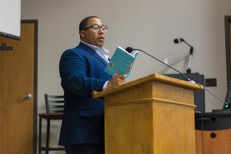 American poet Marcus Wicker does a poetry reading in Harvey Auditorium. - Photo by Nikki Grim