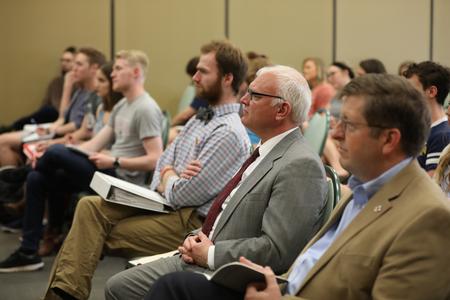 Guests listen to Graham Cole during the STM lecture series. - Photo by Kristi McMurry Woody