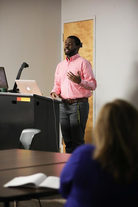 Korey Adams, Spanish major, presents his research during the Scholarship Symposium. - Photo by Kristi McMurry Woody