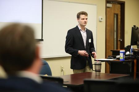 Spencer McCloy, economics major, makes a presentation during the annual Scholarship Symposium. - Photo by Kristi McMurry Woody