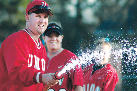 Coach Dunn and his players wet the field after their win against Campbellsville University. - Photo by Amanda Herron