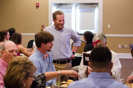 Matt Brunet, associate professor of sport management, mingles at the first ever Top Dawg athletic awards banquet. - Photo by Jess Newendyke