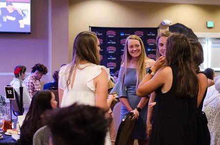 Students mingle at the beginning of the Top Dawg athletic awards. - Photo by Jess Newendyke