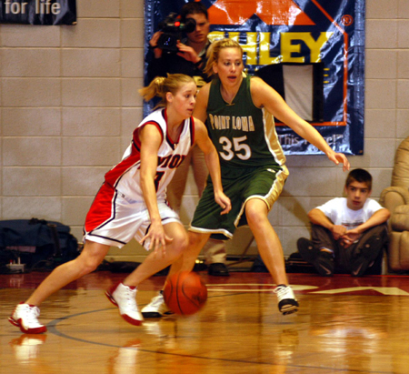 Freshman guard Crystal Eason drives past a Point Loma defender in Union semifinal win in the NAIA Women's National Tournament. - Photo by Morris Abernathy