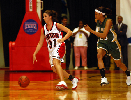 Freshman guard Merideth Richardson brings the ball up the floor in Union's semifinal win over Point Loma Nazarene in the NAIA Women's National Tournament. - Photo by Morris Abernathy