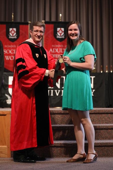 John Kinchen, professor of music and department chair, presents the academic excellence award for music to Joy Moore. - Photo by Kristi McMurry Woody