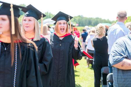 MBA graduates excitedly process into graduation. - Photo by Kristi McMurry Woody