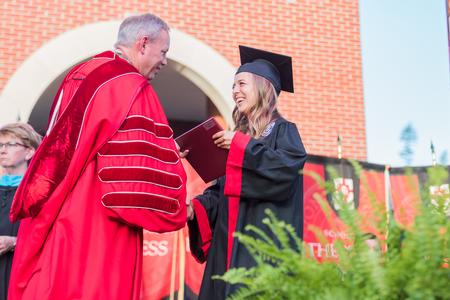 Tamara Friesen, digital media communications, receives her diploma during spring commencement. - Photo by Kristi McMurry Woody