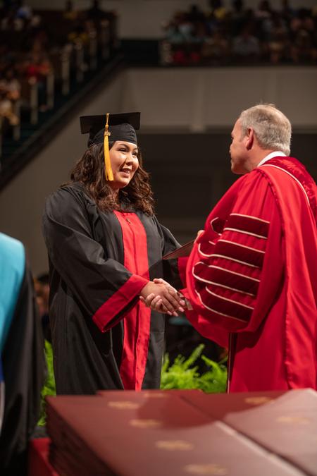 Students receive diplomas at summer graduation. - Photo by Kristi McMurry Woody