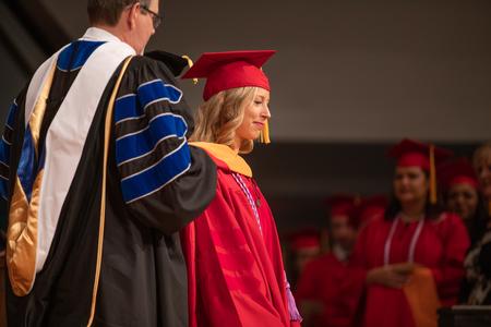 Doctoral graduates receive their hoods during summer commencement. - Photo by Kristi McMurry Woody