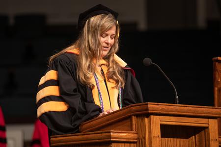 Melissa Lefave, associate professor of nurse anesthesia and assistant chair, delivers the benediction at the end of summer commencement. - Photo by Kristi McMurry Woody