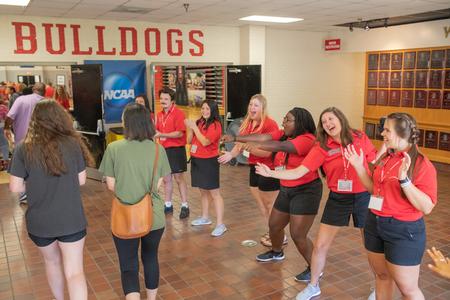 Welcome Week leaders pump up the new students as they walk into the check-in area for Move-in Day. - Photo by Kristi McMurry Woody
