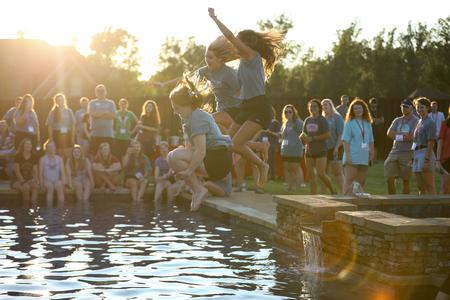 Welcome Week leaders jump in the pool at Dub & Susie Oliver's house during the annual ice cream social. - Photo by Kristi McMurry Woody