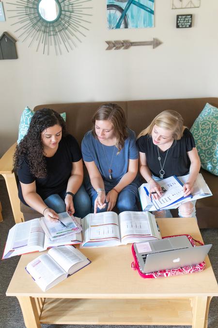 Macy Morrison, Morgan Ray and Callie Hauss, nursing majors, work in their dorm room. - Photo by Kristi McMurry Woody