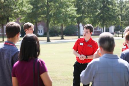 Darius Mullin, biology major, gives a campus tour during Homeschool Day at the U. - Photo by Kristi McMurry Woody