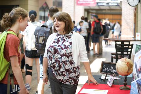 Victoria Malone, study abroad program coordinator, talks with students during the Study Abroad Fair.  - Photo by Kristi McMurry Woody