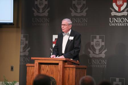 John Adams introduces Mark Campbell as the speaker for the Auxiliary Luncheon. - Photo by Kristi McMurry Woody