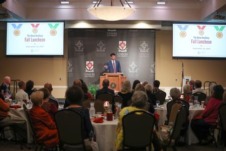 Mark Campbell, head women's basketball coach, speaks at the Auxiliary Luncheon. - Photo by Kristi McMurry Woody