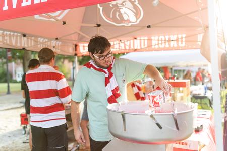 Members of Student Activities Council make cotton candy during Union Night. - Photo by Kristi McMurry Woody