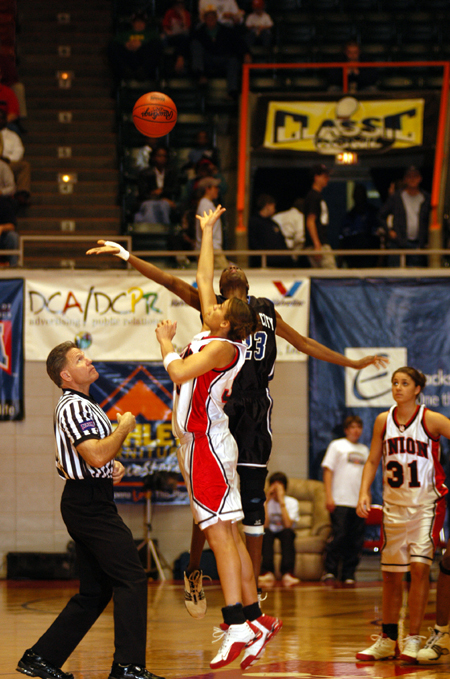 Stephanie Clark and an Oklahoma City player jump in the opening tip of the NAIA National Championship game, Union won 67-63. - Photo by Morris Abernathy