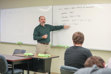 George Moss, associate professor of mathematics and department chair, teaches a class. - Photo by Kristi McMurry Woody