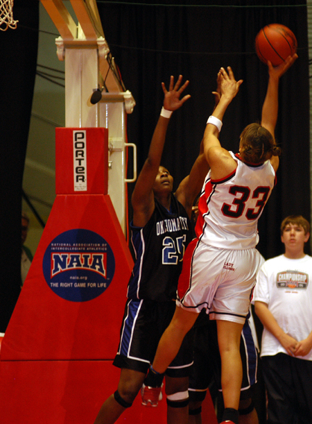 Senior forward Stephanie Clark takes a shot over an Oklahoma City player in Union's win in the title game of the NAIA National Tournament. - Photo by Morris Abernathy