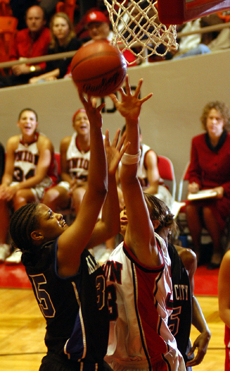Stephanie Clark attempts to block a shot duirng Union's win over Oklahoma City during the NAIA National Tournament. - Photo by Morris Abernathy