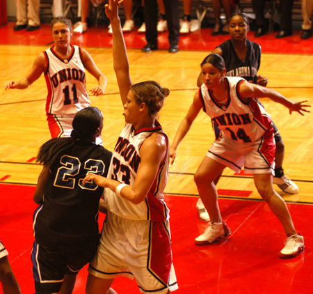 Stephanie Clark (33) plays defense on an Oklahoma City player during the NAIA National Tournament.  Tiffany Fisher (14) and Jennifer Henson (11) are ready to help out. - Photo by Morris Abernathy