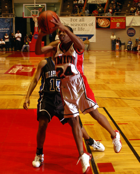 Senior guard Monica Elliot (24) drives in for a layup in Union's 67-63 win over Oklahoma City in the NAIA National Tournament. - Photo by Morris Abernathy