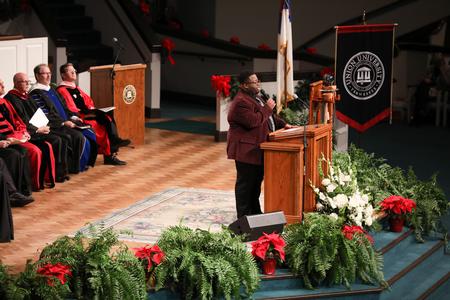 Cameron Smith, music major, performs during fall commencement services. - Photo by Kristi McMurry Woody