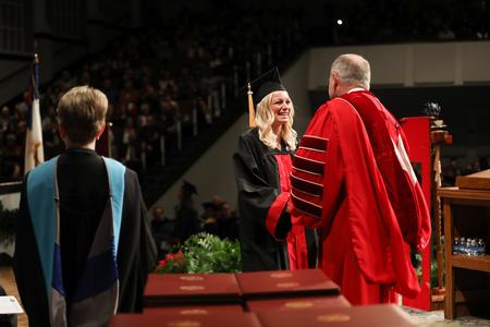 Students receive diplomas during fall commencement. - Photo by Kristi McMurry Woody
