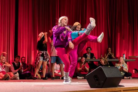Welcome Week leaders perform on stage for new students during the Welcome Week Show. - Photo by Nikki Grim