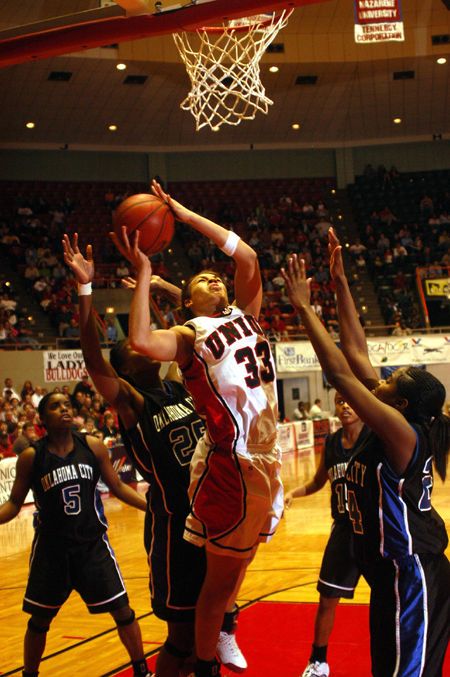 Stephanie Clark (33) beats four Oklahoma City defenders to the for a shot during Union win in the champmionship game of the NAIA National Tournament. - Photo by Morris Abernathy