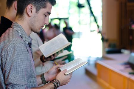 Students read along with scripture during chapel. - Photo by Jess Newendyke