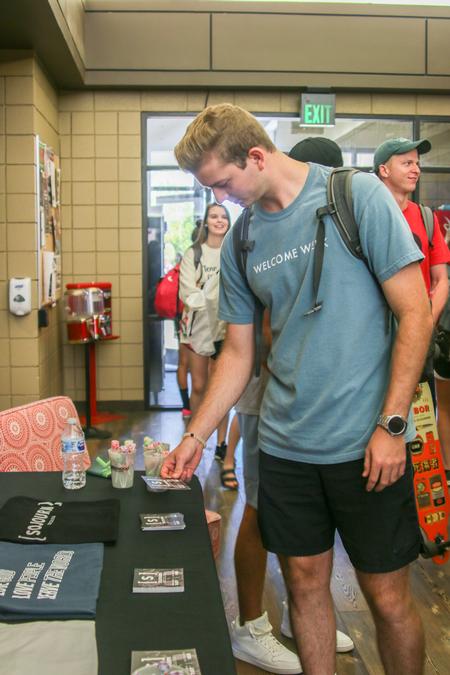 Students peruse booths at the Church Expo in the SUB hallway. - Photo by Hannah Heckart