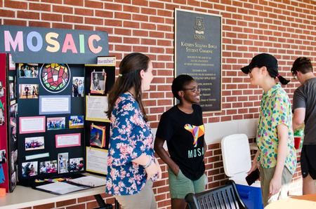 Students enjoy the MOSAIC back-to-school cookout.  - Photo by Jess Newendyke