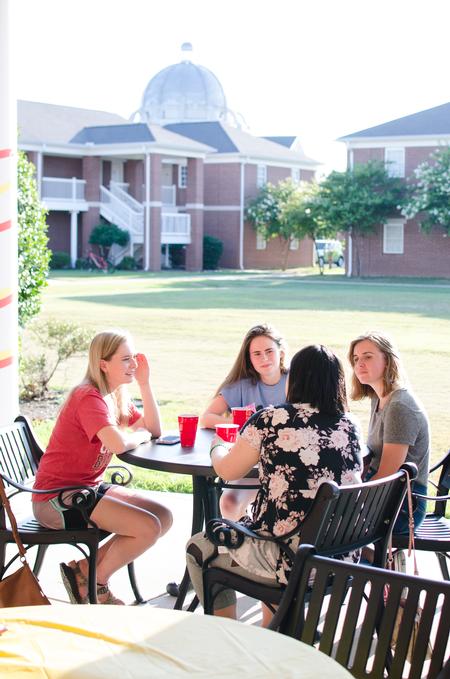 Students enjoy the MOSAIC back-to-school cookout on the patio of the Bowld Student Commons. - Photo by Jess Newendyke