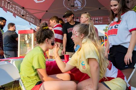 Members of Student Activities Council paint faces during Union Night. - Photo by Nikki Grim