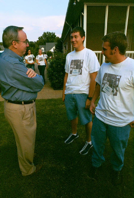 Freshmen Dan Dresselhaus and Josh Brubaker chat with Dr. David S. Dockery at the Ice Cream Social at Dr. Dockery's house during New Student Orientation 2002. - Photo by Kristen Hiller