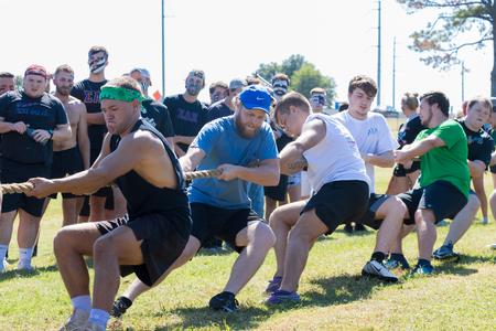 Students participate in the tug-of-war event during Greek Olympics.  - Photo by Nikki Grim