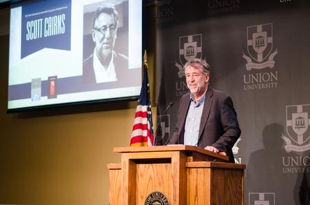 Scott Cairns speaks in the Grant Events Center during the Lyceum Reading. - Photo by Jess Newendyke