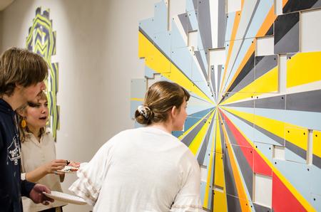 Guests admire the work of Gene Schmidt in the Union Art Gallery. - Photo by Jess Newendyke