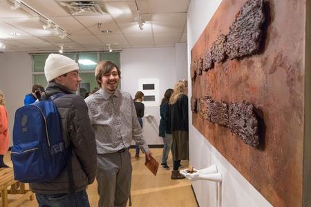 Students view the work of Chris Nadaskay in the Union Art Gallery after his gallery lecture.  - Photo by Nikki Grim