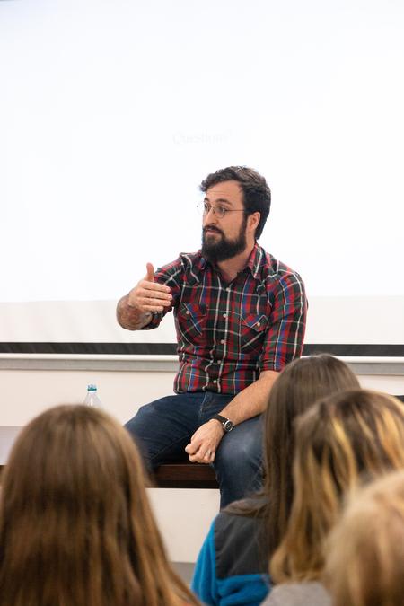 Aaron Hardin, assistant professor of communication arts, gives an artist lecture in the PAC. - Photo by Hannah Heckart